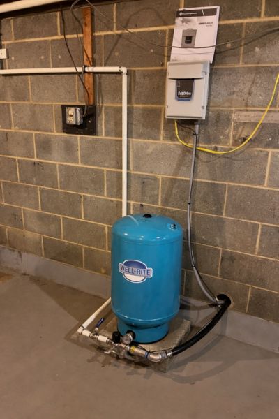 Well pressure tank and control box setup installed by DeRidder's Water Solutions