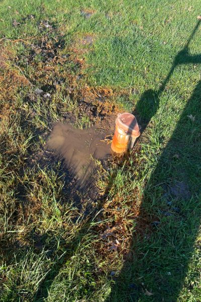 Well head with muddy water in South Jersey yard — a sign it's time for well inspection and repair